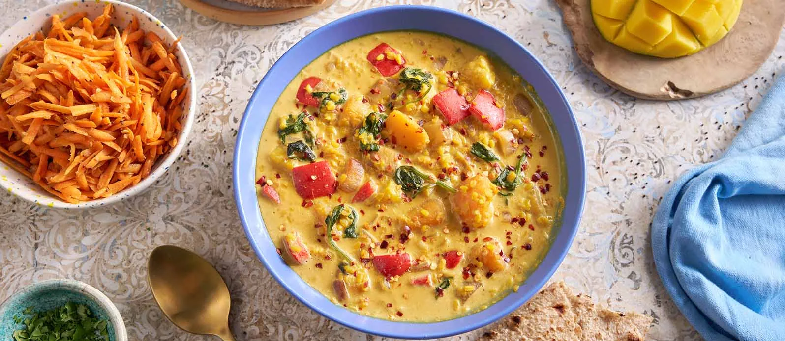 Moong Dal mit Kürbis, Mango und Kokosnuss